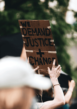 Cardboard Sign Calling For Justice And Change Employment Tribunal Fees Thumbnail