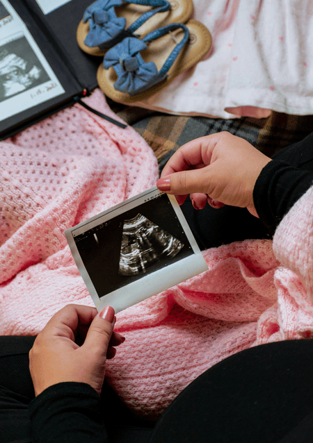 Woman Holds Pregnancy Scan Statutory Maternity Pay Discrimination Pregnant Women Thumbnail